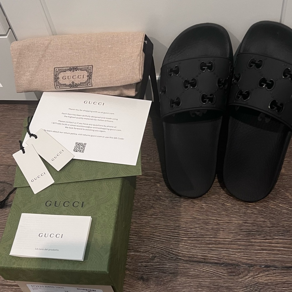 Authentic Gucci rubber GG slide sandal.